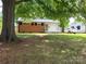 Charming single-story home with brick and siding, mature trees, and a well-manicured lawn at 2939 Lasalle St, Charlotte, NC 28216
