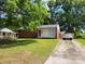 Charming single-story home with brick accents, a well-maintained lawn, and a private driveway at 2939 Lasalle St, Charlotte, NC 28216