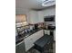 Modern kitchen featuring white cabinetry, black countertops, and stainless steel appliances at 2939 Lasalle St, Charlotte, NC 28216