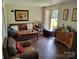 Inviting living room features hardwood floors and a comfortable seating arrangement with a wine bar at 2939 Lasalle St, Charlotte, NC 28216