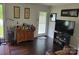 Cozy living room with a wooden bar cabinet, perfect for entertaining guests and unwinding at 2939 Lasalle St, Charlotte, NC 28216