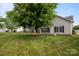 Backyard with lush green grass, mature trees, and a view of the home at 301 Garner Dr, Salisbury, NC 28146