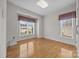 Bright bedroom with hardwood floors and natural light from the windows at 301 Garner Dr, Salisbury, NC 28146