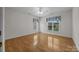 Bright bedroom with hardwood floors, ceiling fan, and natural light from the windows at 301 Garner Dr, Salisbury, NC 28146