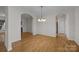 Inviting dining room with hardwood floors and elegant chandelier and easy access to the kitchen and living spaces at 301 Garner Dr, Salisbury, NC 28146