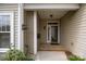 Covered entryway featuring a 'Welcome' sign and an outdoor light fixture with a clear front door at 301 Garner Dr, Salisbury, NC 28146