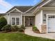 A close-up of the front door of a charming single-Gathering home with a sidewalk leading to the entrance at 301 Garner Dr, Salisbury, NC 28146