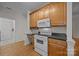 Kitchen area shows white stove with wood cabinets and black countertops at 301 Garner Dr, Salisbury, NC 28146