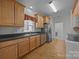 Well-lit kitchen features stainless steel appliances, wood cabinets and black countertops at 301 Garner Dr, Salisbury, NC 28146