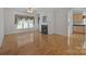 Cozy living room features hardwood floors, a fireplace with a mantel, and natural light streaming in from the windows at 301 Garner Dr, Salisbury, NC 28146