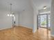 Spacious living room with hardwood floors, chandelier, and views of other rooms, creating an open and inviting space at 301 Garner Dr, Salisbury, NC 28146