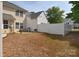Backyard with a small patio area and white fence offering privacy at 3050 Des Prez Ave, Fort Mill, SC 29707