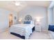 Cozy bedroom with a queen-sized bed, stylish lamps, and a window seat, filled with soft, natural light at 3050 Des Prez Ave, Fort Mill, SC 29707