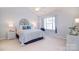 Comfortable bedroom with vaulted ceiling, window seat, and stylish furnishings, illuminated by natural light at 3050 Des Prez Ave, Fort Mill, SC 29707