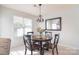 Formal dining room area featuring a chandelier and view to the outside at 3050 Des Prez Ave, Fort Mill, SC 29707