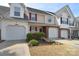 Charming townhome featuring a one-car garage, neutral siding, and well-maintained landscaping, enhancing curb appeal at 3050 Des Prez Ave, Fort Mill, SC 29707