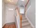 Inviting foyer with hardwood floors, a staircase with wooden banister, and a bright white front door at 3050 Des Prez Ave, Fort Mill, SC 29707