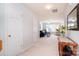 Bright hallway leading to a living area with plush carpeting, creating a seamless transition between spaces at 3050 Des Prez Ave, Fort Mill, SC 29707