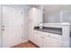 Well-lit kitchen area with white cabinets and gray countertops, plus door to outside at 3050 Des Prez Ave, Fort Mill, SC 29707