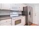 Bright kitchen features white cabinets, stainless steel appliances, and laminate countertops at 3050 Des Prez Ave, Fort Mill, SC 29707