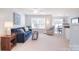 Comfortable living room filled with natural light, showcasing neutral walls and plush carpeting for a welcoming ambiance at 3050 Des Prez Ave, Fort Mill, SC 29707