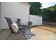 Cozy backyard patio area with outdoor seating and a privacy fence at 3050 Des Prez Ave, Fort Mill, SC 29707