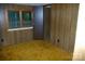 The bedroom features a paneled wall, a window, and a doorway to another room at 3225 Sawmill Rd, Hickory Grove, SC 29717