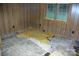 Bedroom with damaged flooring and paneled walls at 3225 Sawmill Rd, Hickory Grove, SC 29717