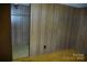 The bedroom features paneled walls and a doorway to another room at 3225 Sawmill Rd, Hickory Grove, SC 29717