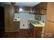 The kitchen has wooden cabinets and a stainless-steel sink at 3225 Sawmill Rd, Hickory Grove, SC 29717