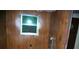 The laundry room shows washer hookups, paneled walls and a window at 3225 Sawmill Rd, Hickory Grove, SC 29717