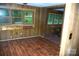 Living room with wood-look floors and a window with blinds at 3225 Sawmill Rd, Hickory Grove, SC 29717