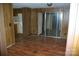 Living room features wood-look floors and sliding glass doors to another room at 3225 Sawmill Rd, Hickory Grove, SC 29717