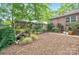 Lush backyard with diverse foliage, including a charming water feature and tranquil gardening area at 3430 Rea Rd, Charlotte, NC 28226
