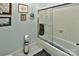 Bathroom featuring tiled walls, shower with glass door, and modern fixtures at 3430 Rea Rd, Charlotte, NC 28226