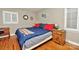This comfy bedroom features hardwood floors, plentiful natural light, and neutral colors at 3430 Rea Rd, Charlotte, NC 28226