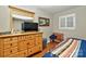 Cozy bedroom features wood floors, natural light from a window, and a relaxing atmosphere at 3430 Rea Rd, Charlotte, NC 28226