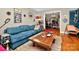 Bright and inviting living room with hardwood floors, stylish decor, and an open doorway to additional space at 3430 Rea Rd, Charlotte, NC 28226