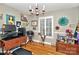 Bright office space with a chandelier, large window, and decorative artwork on the walls at 3430 Rea Rd, Charlotte, NC 28226