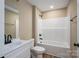 Bright bathroom with black fixtures, white vanity, and shower-tub combination at 355 Northbrook Iii School Rd # 10, Vale, NC 28164