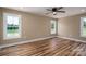 Spacious bedroom with wood-look floors and several windows providing ample natural light at 355 Northbrook Iii School Rd # 10, Vale, NC 28164