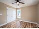 Bedroom featuring wood-look flooring, closet, and a ceiling fan at 355 Northbrook Iii School Rd # 10, Vale, NC 28164