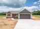 Beautiful exterior showcasing a beige house, brown garage door, and inviting driveway at 355 Northbrook Iii School Rd # 10, Vale, NC 28164