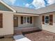 Charming covered front porch with brick base and wood shutters at 355 Northbrook Iii School Rd # 10, Vale, NC 28164