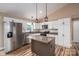 Modern kitchen showcasing white cabinets, stainless steel appliances, and a functional center island at 355 Northbrook Iii School Rd # 10, Vale, NC 28164