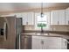 Well-lit kitchen area showcasing stainless steel appliances, white cabinetry, and a granite-look countertop at 355 Northbrook Iii School Rd # 10, Vale, NC 28164