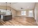 Bright open-concept with a kitchen island, white cabinetry, and natural light at 355 Northbrook Iii School Rd # 10, Vale, NC 28164