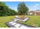 Large level backyard with gravel patio and seating at 3937 Tamerlane Dr, Charlotte, NC 28205