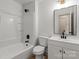 Modern bathroom featuring a shower-tub combo and a white vanity at 3937 Tamerlane Dr, Charlotte, NC 28205