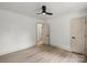 Spacious bedroom with ceiling fan, neutral walls and light hardwood floors at 3937 Tamerlane Dr, Charlotte, NC 28205